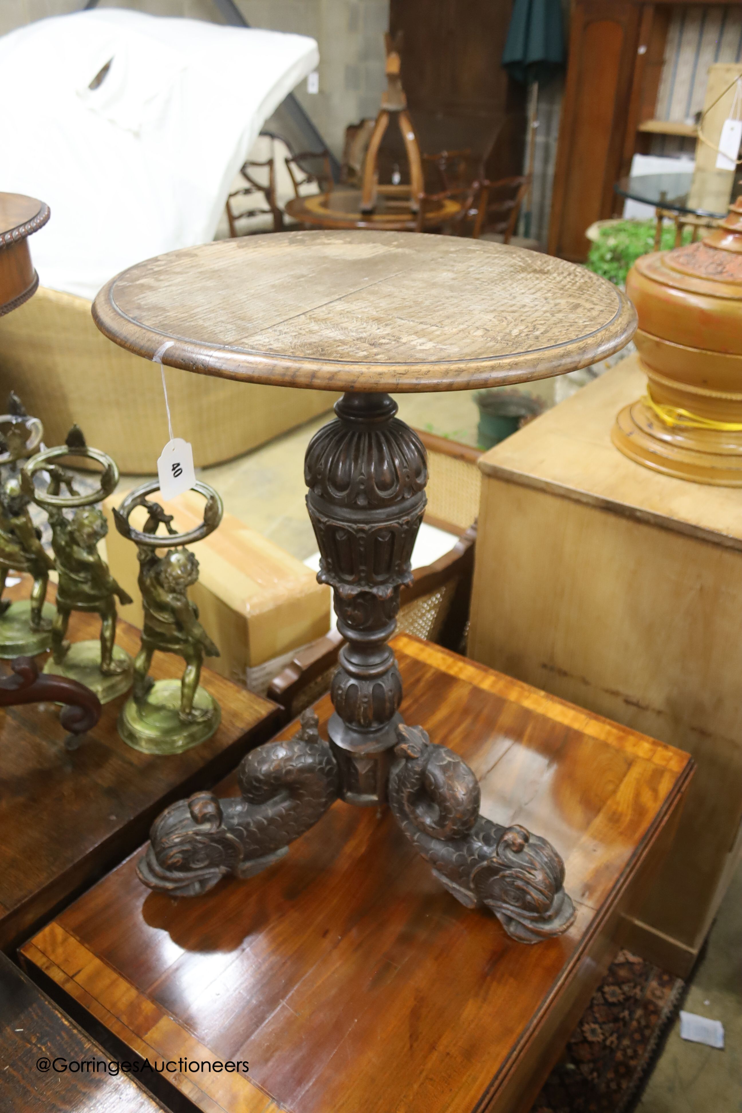 A carved oak and hardwood circular occasional table, diameter 50cm, height 74cm